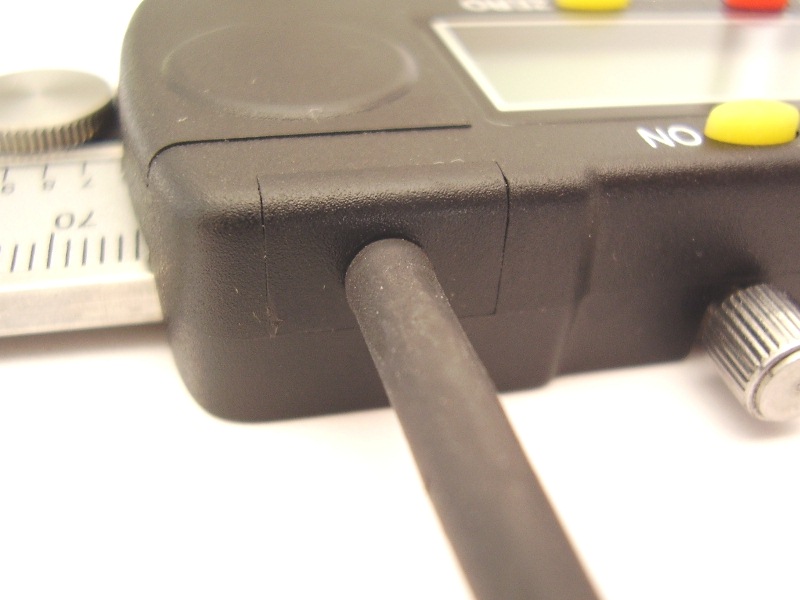 Data cable inserted through glued plastic cover
